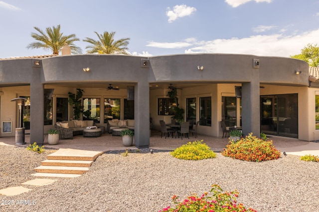 690 E Seattle Slew Ln, Gilbert, AZ 85296 - back of house featuring outdoor lounge area, a ceiling fan, a patio, and stucco siding