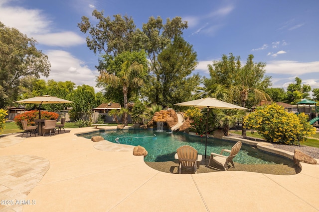 690 E Seattle Slew Ln, Gilbert, AZ 85296 - swimming pool featuring a patio area, a water slide, and a playground