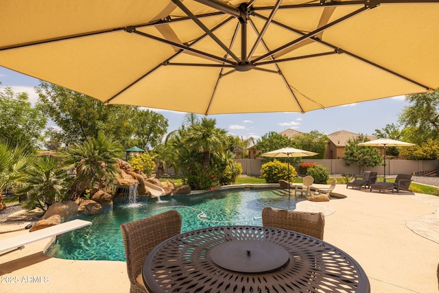 690 E Seattle Slew Ln, Gilbert, AZ 85296 - view of swimming pool with outdoor dining space, a fenced backyard, and a patio