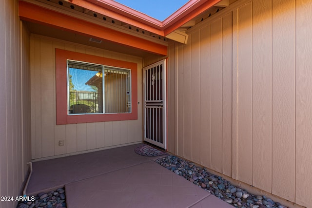 entrance to property featuring a patio area