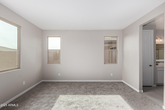 carpeted empty room with sink