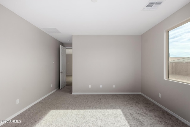 unfurnished room with light carpet