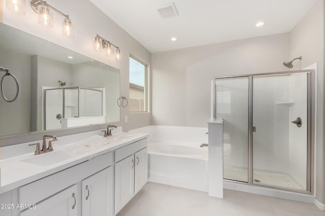 bathroom with tile patterned floors, vanity, and plus walk in shower