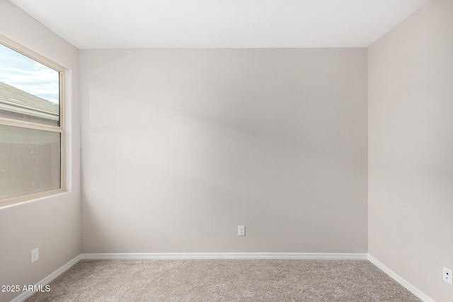 empty room with carpet flooring