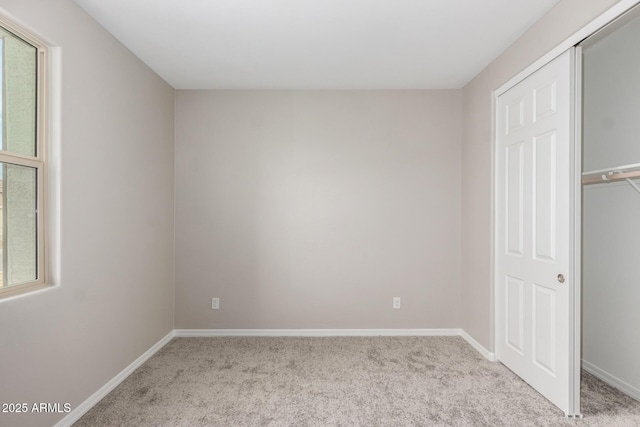 unfurnished bedroom with light carpet