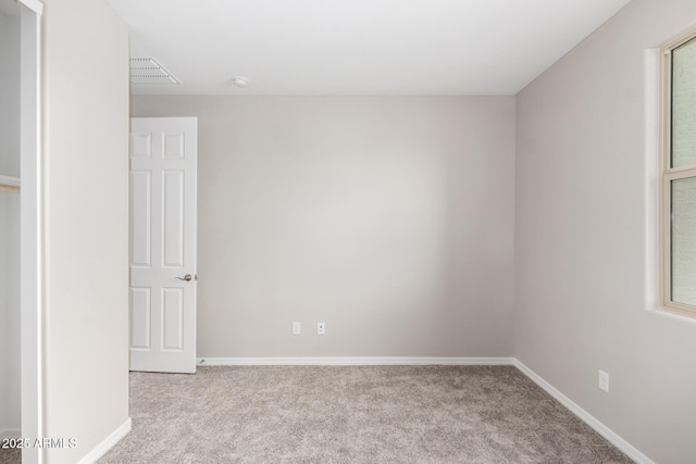 spare room with light carpet