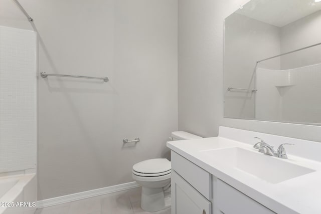 bathroom with tile patterned flooring, vanity, and toilet