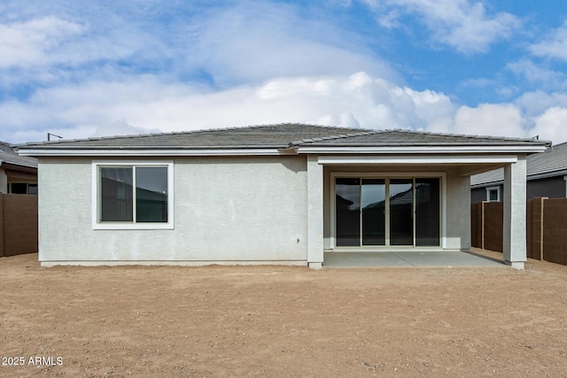 back of property with a patio area