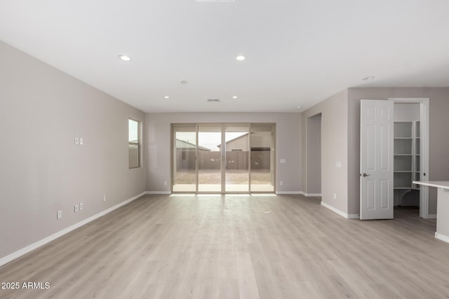 unfurnished room featuring light wood-type flooring