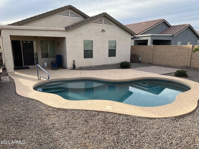 view of pool with a patio, fence, and a fenced in pool