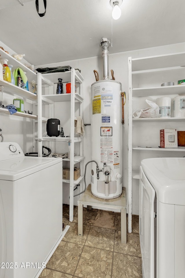 10806 N 114th Ave, Youngtown, AZ 85363 - clothes washing area featuring gas water heater, washer and clothes dryer, and laundry area
