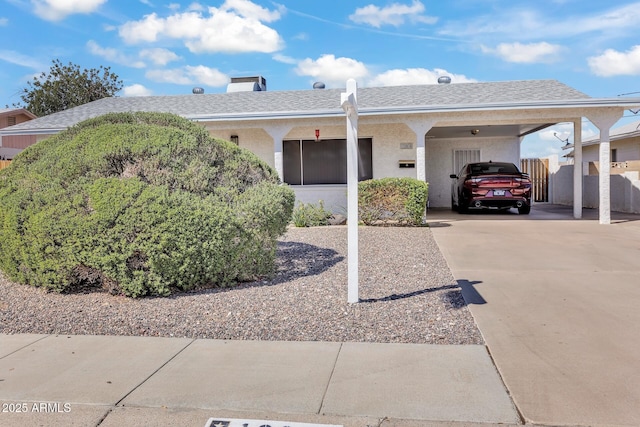 10806 N 114th Ave, Youngtown, AZ 85363 - ranch-style house featuring stucco siding, concrete driveway, roof with shingles, and a carport