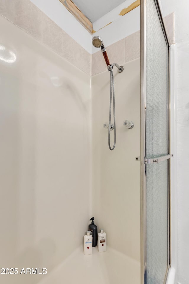 10806 N 114th Ave, Youngtown, AZ 85363 - bathroom featuring a shower with shower door