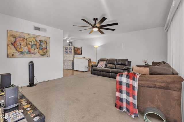 10806 N 114th Ave, Youngtown, AZ 85363 - carpeted living room featuring visible vents and a ceiling fan