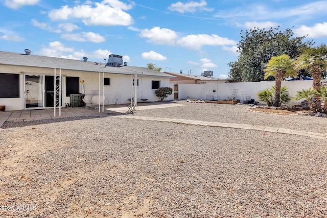 10806 N 114th Ave, Youngtown, AZ 85363 - back of house with a patio, fence, and stucco siding