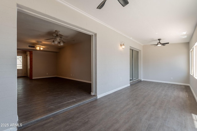 unfurnished living room with wood finished floors, baseboards, and ceiling fan