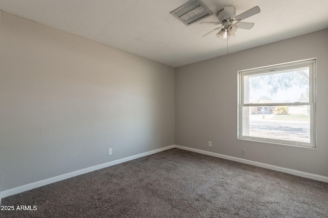 unfurnished room with carpet floors, baseboards, ceiling fan, and visible vents