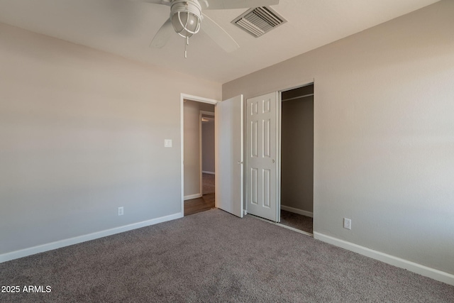 unfurnished bedroom featuring a ceiling fan, a closet, baseboards, visible vents, and carpet floors