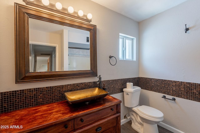 bathroom with toilet and vanity