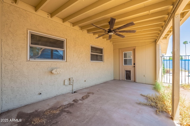 view of patio / terrace featuring a ceiling fan and fence