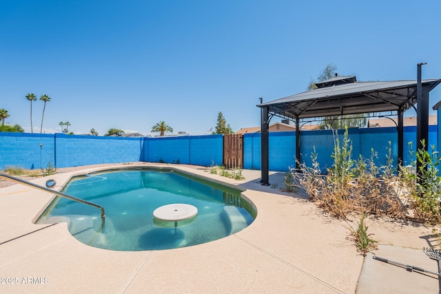 view of pool with a gazebo, a patio area, a fenced in pool, and a fenced backyard