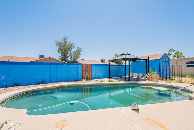view of pool with a gazebo, a fenced in pool, and a fenced backyard