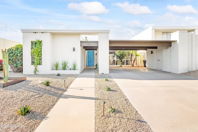 contemporary home featuring a carport