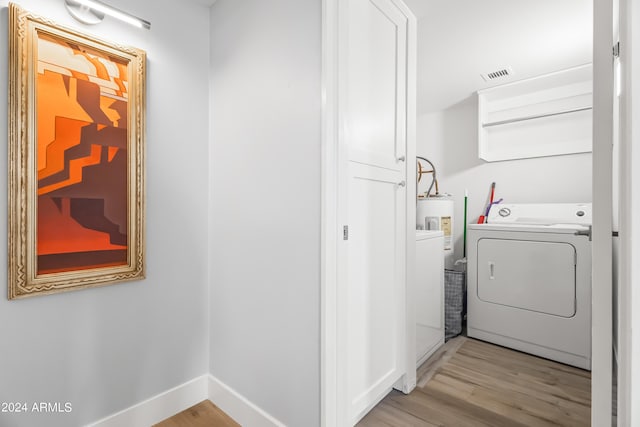 laundry room featuring light hardwood / wood-style flooring