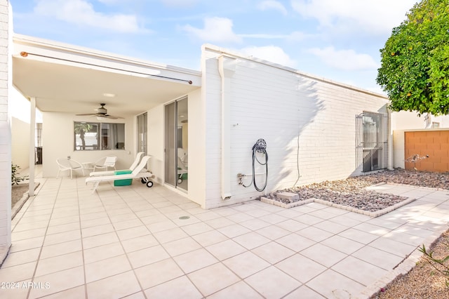 rear view of house featuring a patio area and ceiling fan