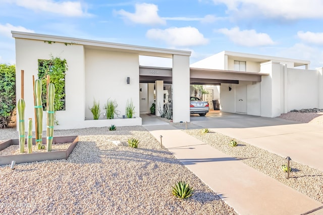 contemporary home featuring a carport