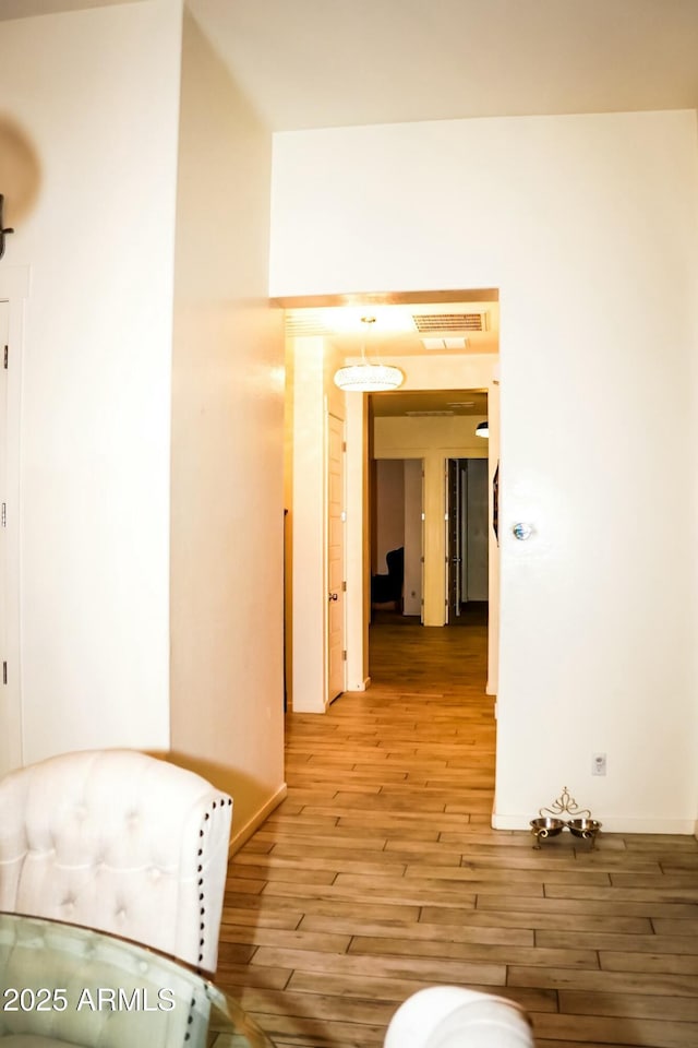 corridor featuring light hardwood / wood-style flooring