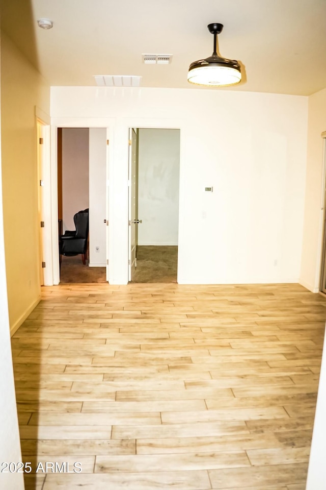 spare room featuring light hardwood / wood-style floors