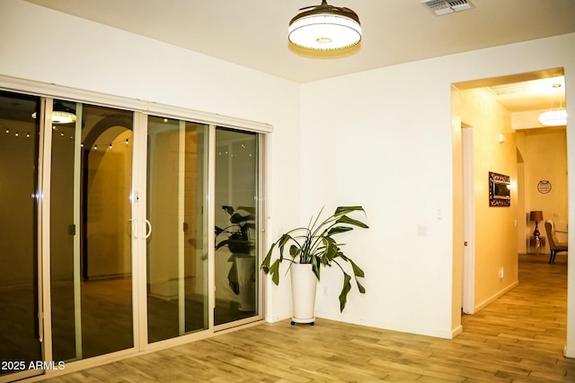 hallway featuring hardwood / wood-style flooring