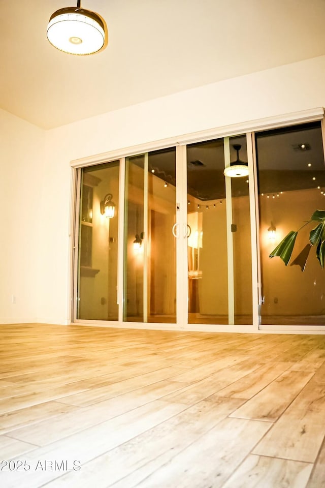 empty room featuring hardwood / wood-style flooring