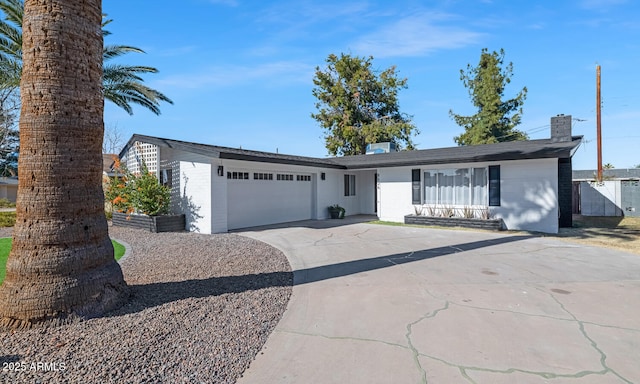 ranch-style home featuring a garage