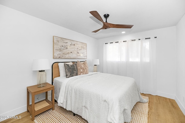 bedroom featuring wood-type flooring and ceiling fan