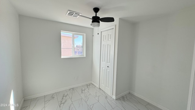 unfurnished room featuring ceiling fan