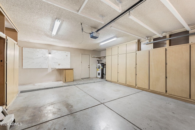 garage with electric water heater and a garage door opener