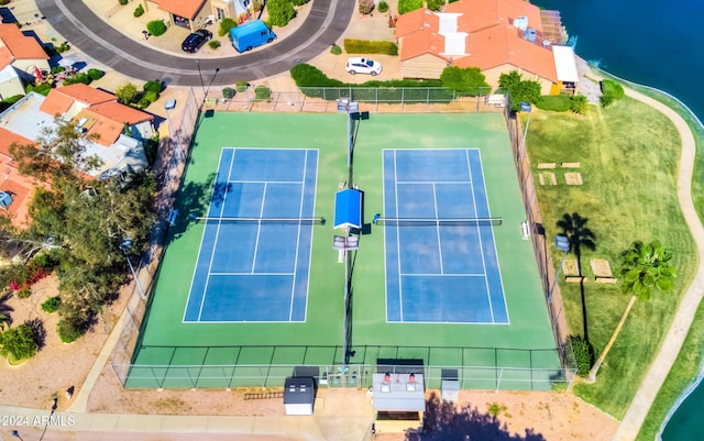 birds eye view of property with a water view