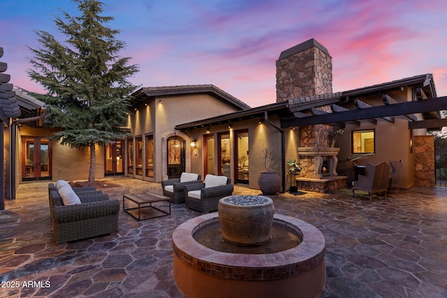 exterior space featuring french doors and an outdoor living space