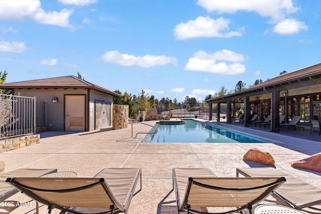 view of swimming pool with a patio area