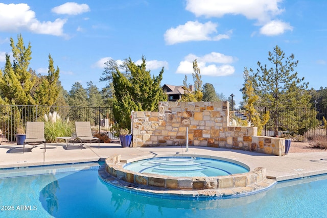 view of pool featuring an in ground hot tub and a patio