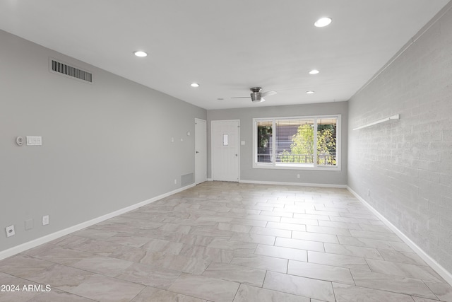 spare room with ceiling fan