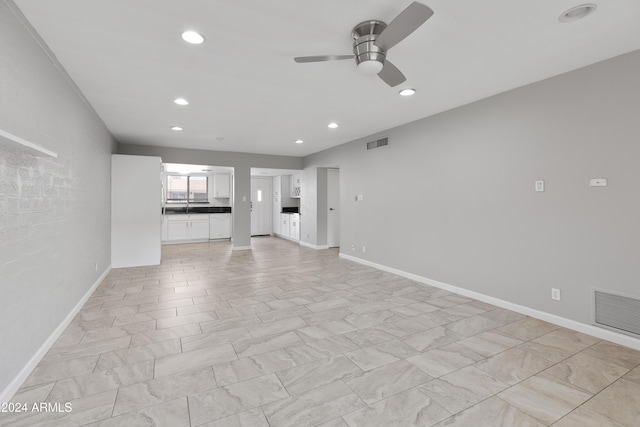 4701 N 68th St Unit 248, Scottsdale, AZ 85251 - unfurnished living room featuring a ceiling fan, recessed lighting, and baseboards