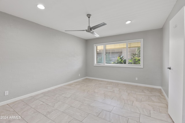 spare room with ceiling fan