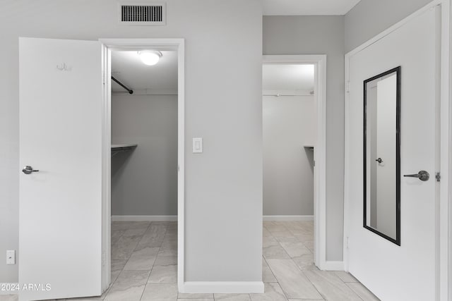 4701 N 68th St Unit 248, Scottsdale, AZ 85251 - corridor with light marble finish floors and baseboards