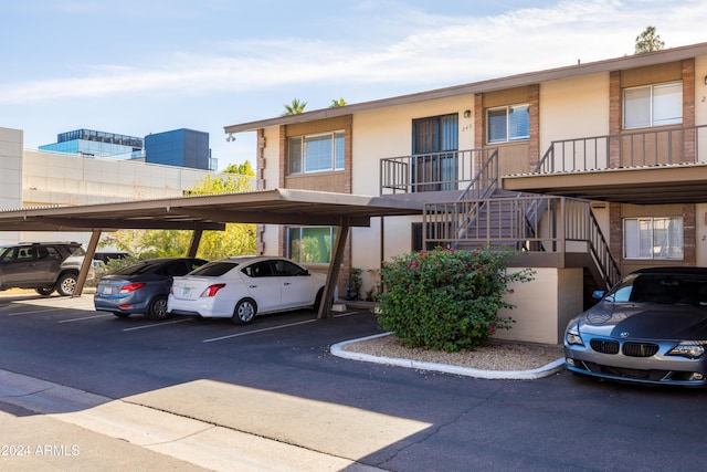 4701 N 68th St Unit 248, Scottsdale, AZ 85251 - view of building exterior featuring stairs and covered parking