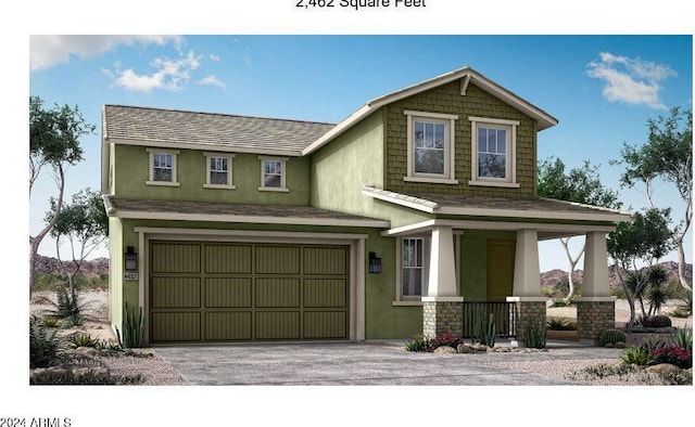 view of front of home with covered porch and a garage