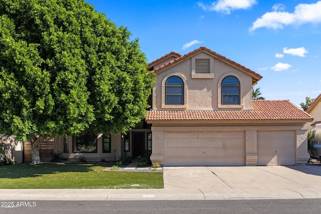 view of front of home featuring a garage and a front lawn