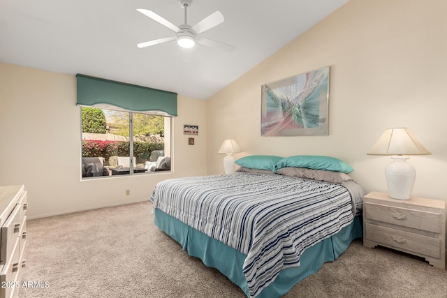 carpeted bedroom featuring lofted ceiling and ceiling fan